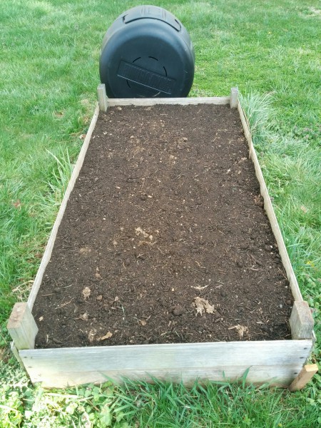 raised bed with radishes and spinach